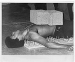 Arrington, Ronald, on bed of nails